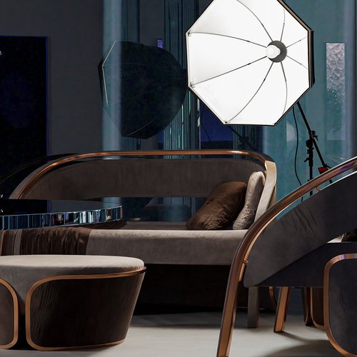 sleek brown sofa and chair with photographers light behind